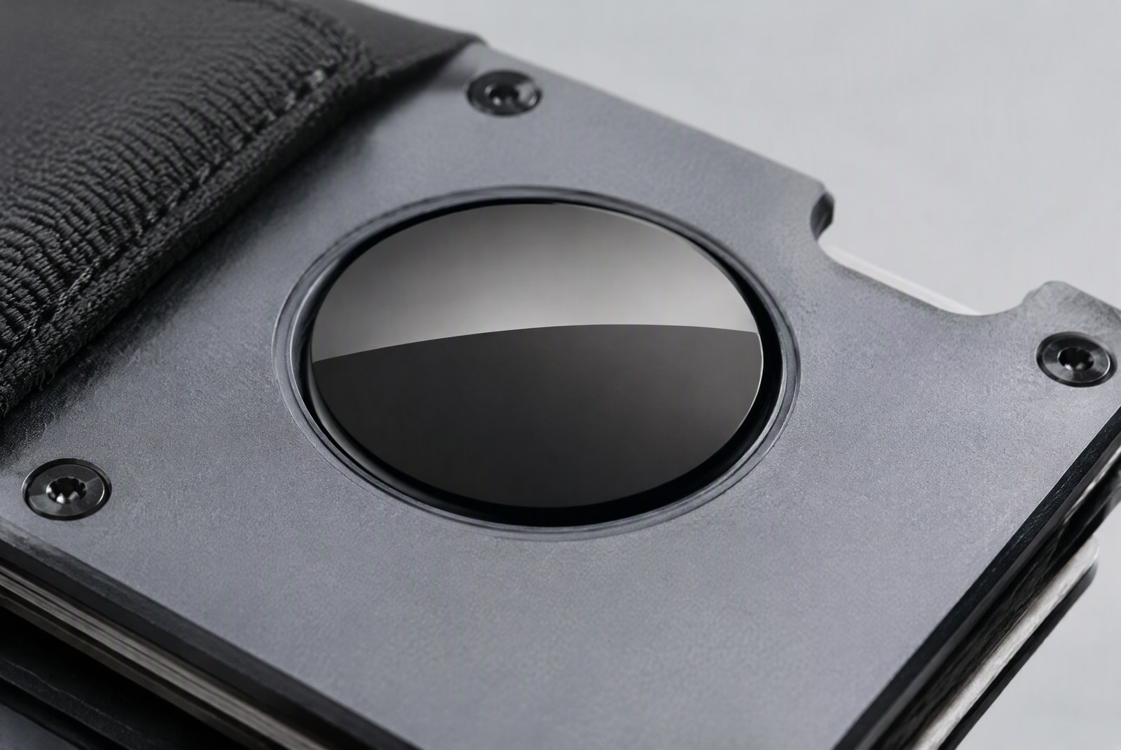 feature: factory photography of wallet materials and production, aluminum and leather panels with an AirTag slot template on the bench