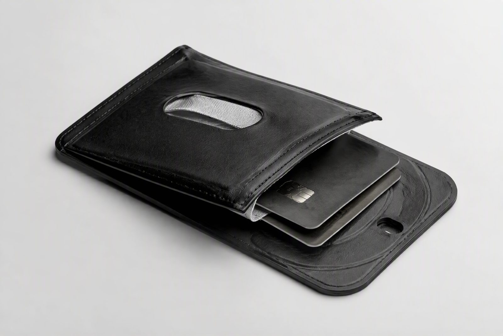 MagSafe wallet cavity open showing two cards and RFID layer inside