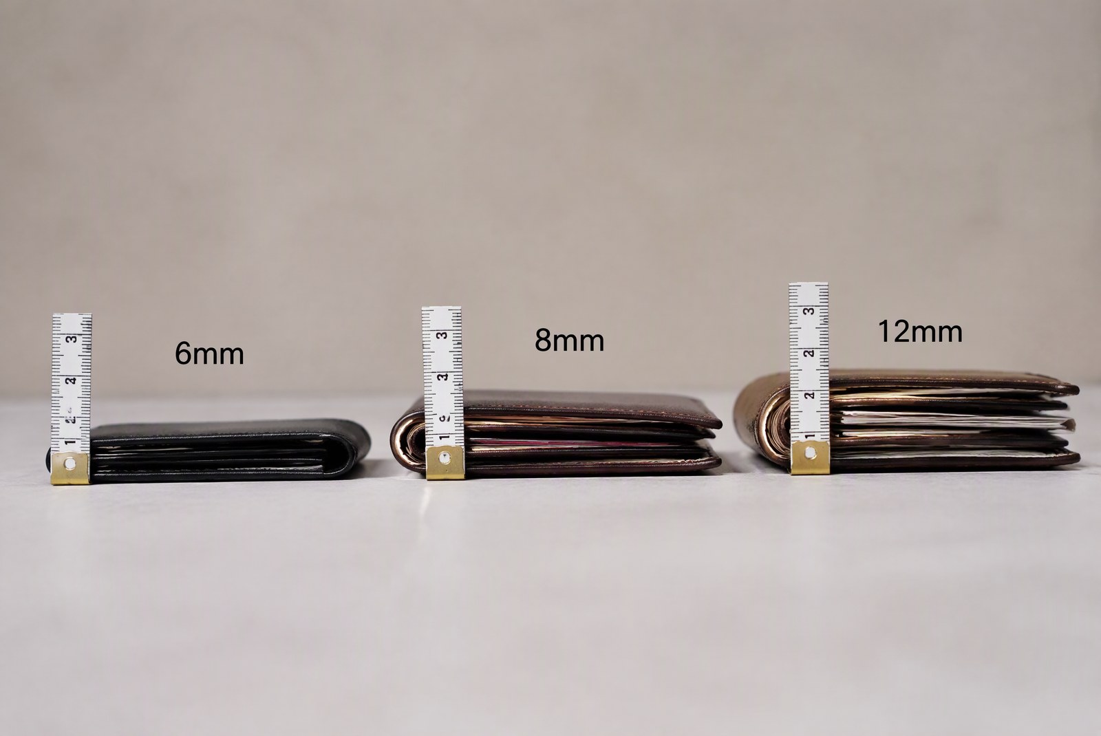 Side-profile thickness comparison: slim cardholders measured with calipers at daily carry