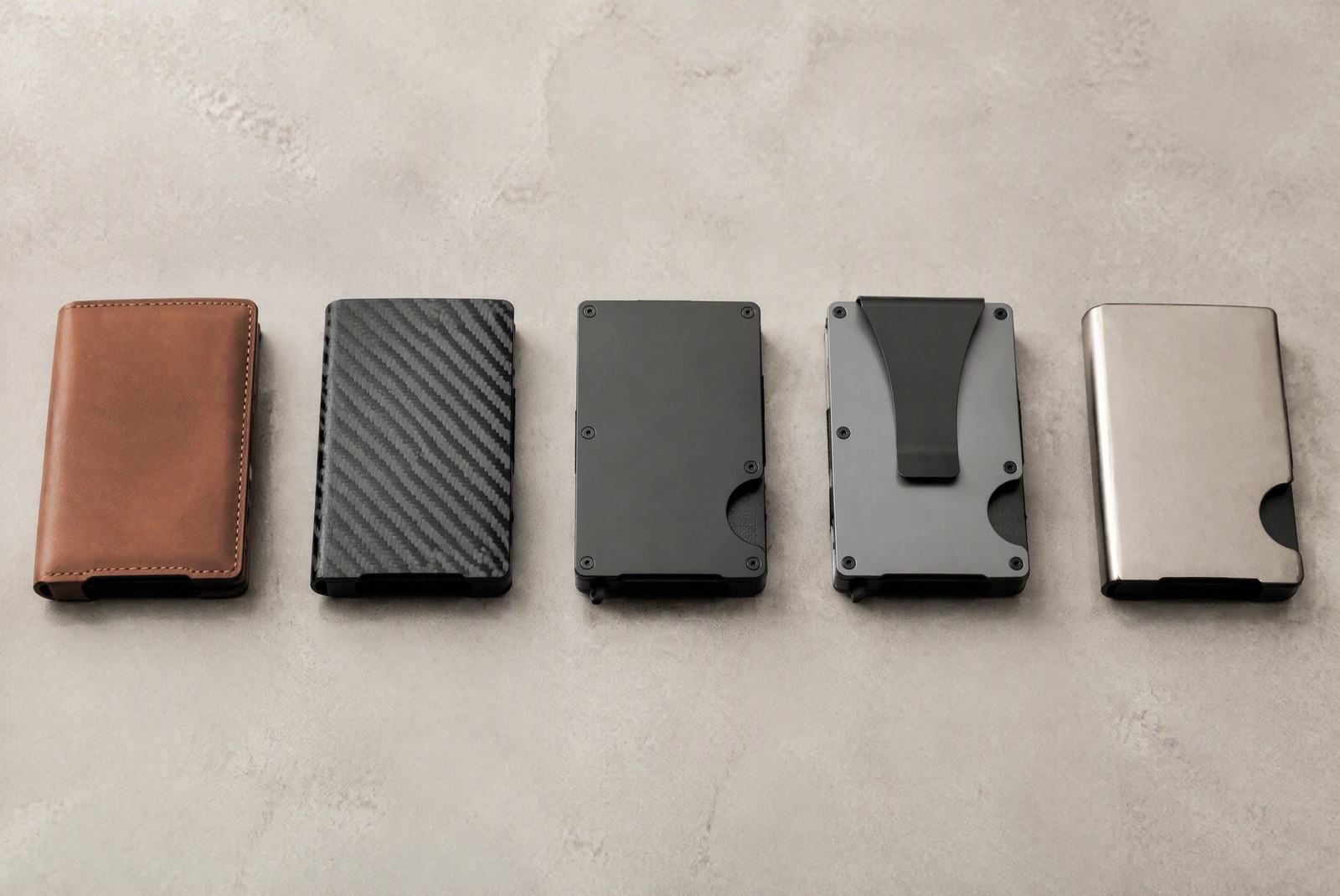 Best RFID wallets 2026 — flat lay of tested leather, carbon fiber and metal wallets